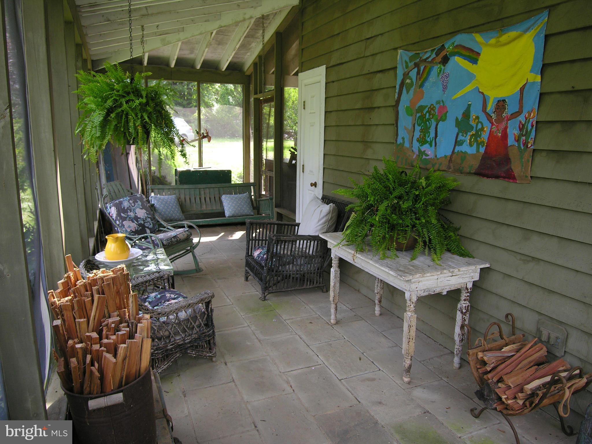 488 Quaintance Road Woodville, VA 22749 - Photo 17 of 20 Side screened porch is great for entertaining