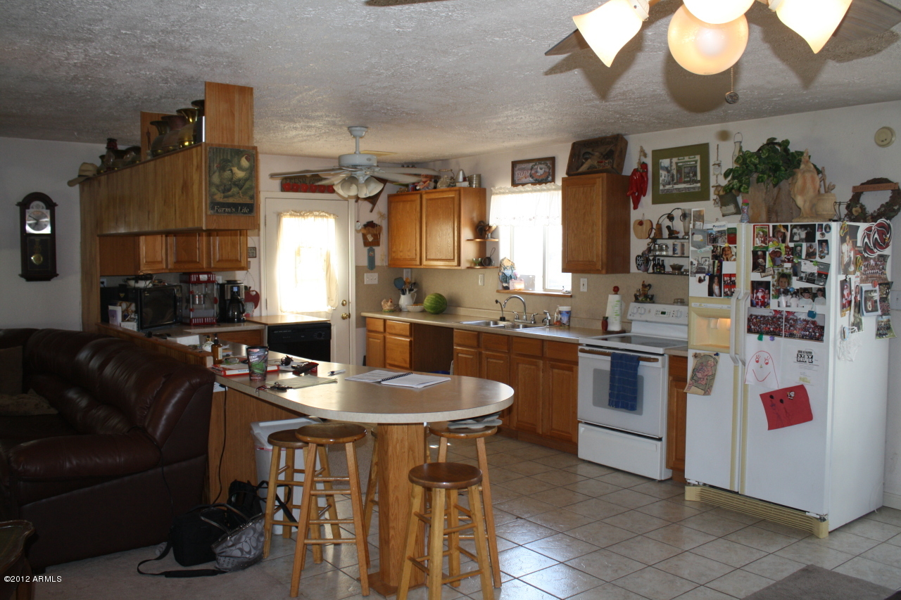 12627 West Varney Road El Mirage, AZ 85335 - Photo 6 of 22 Kitchen Opens to Great Room