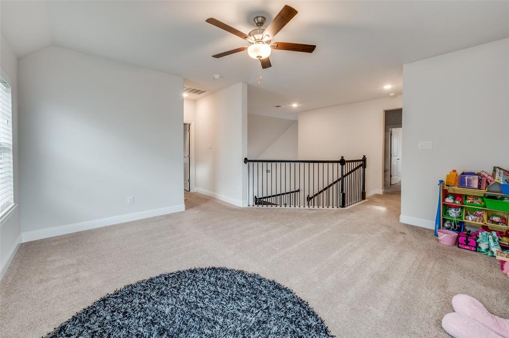 905 Flora Street Mansfield, TX 76063 - Photo 8 of 23 a view of a hallway with a livingroom