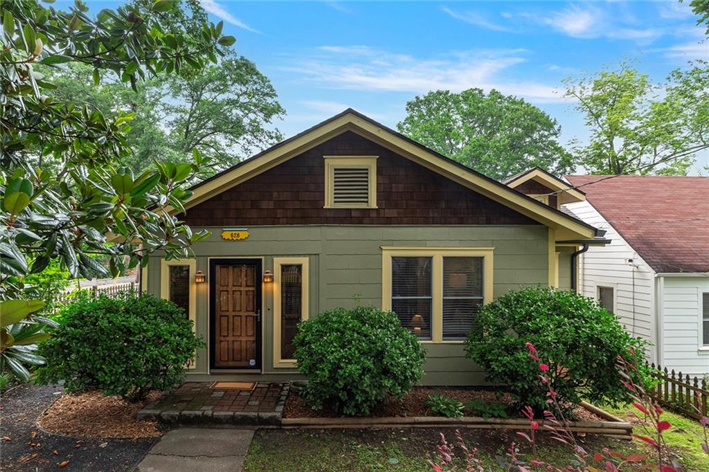 628 Home Avenue Southeast Atlanta, GA 30312 - Photo 1 of 1 a front view of a house with garden