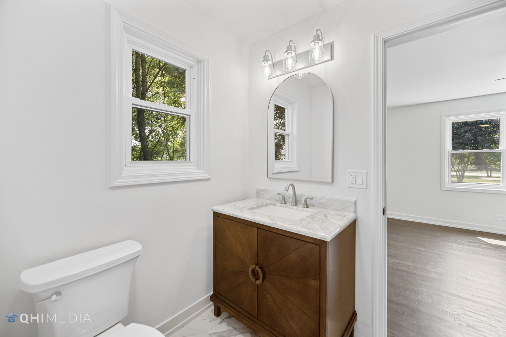 1801 Orchard Road Wheaton, IL 60189 - Photo 18 of 41 a bathroom with a toilet sink and mirror