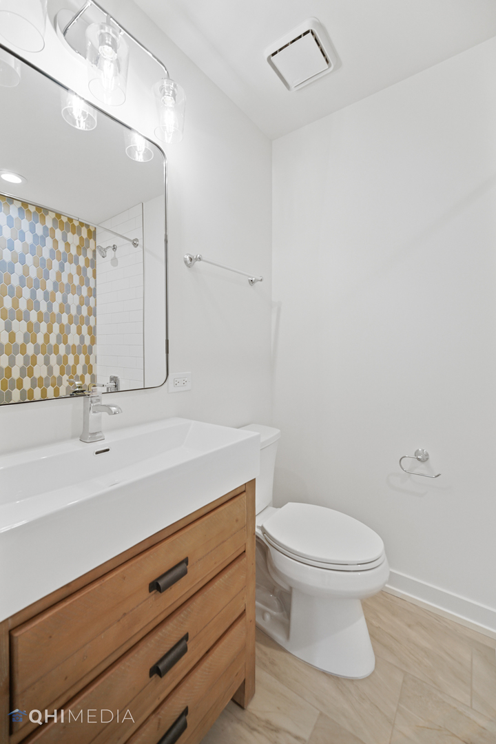 1801 Orchard Road Wheaton, IL 60189 - Photo 24 of 41 a bathroom with a sink a toilet and shower