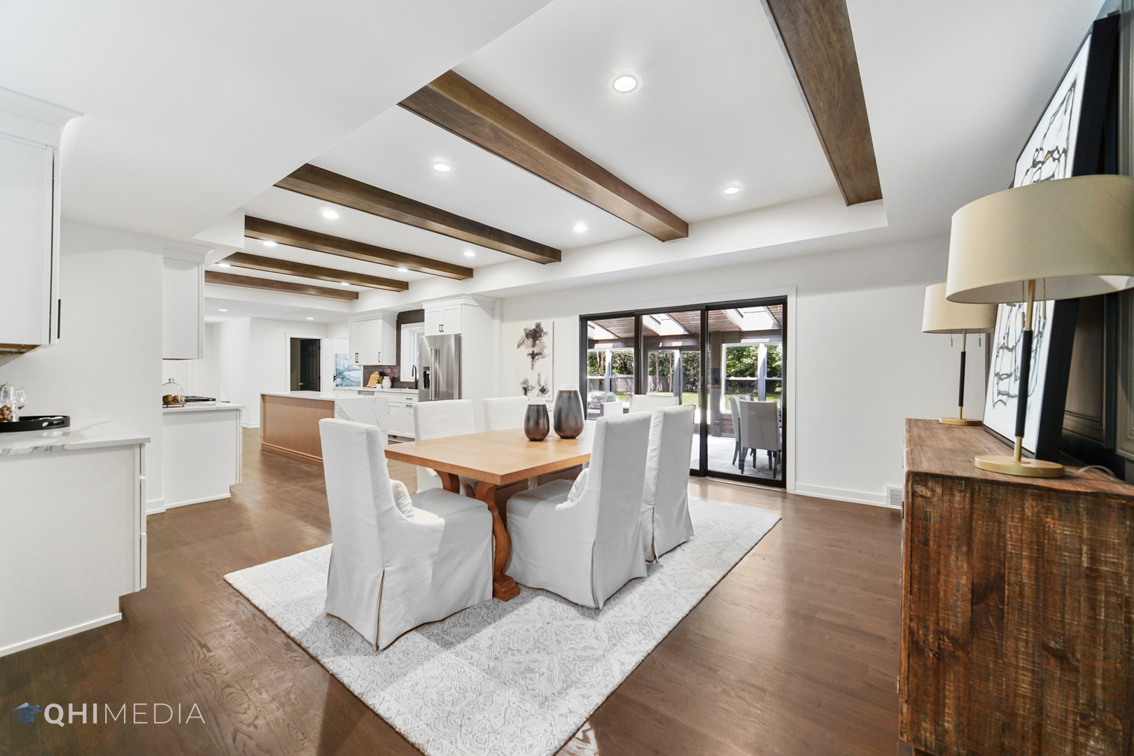 1801 Orchard Road Wheaton, IL 60189 - Photo 7 of 41 a dining hall with stainless steel appliances granite countertop a couch a table and chairs with wooden floor