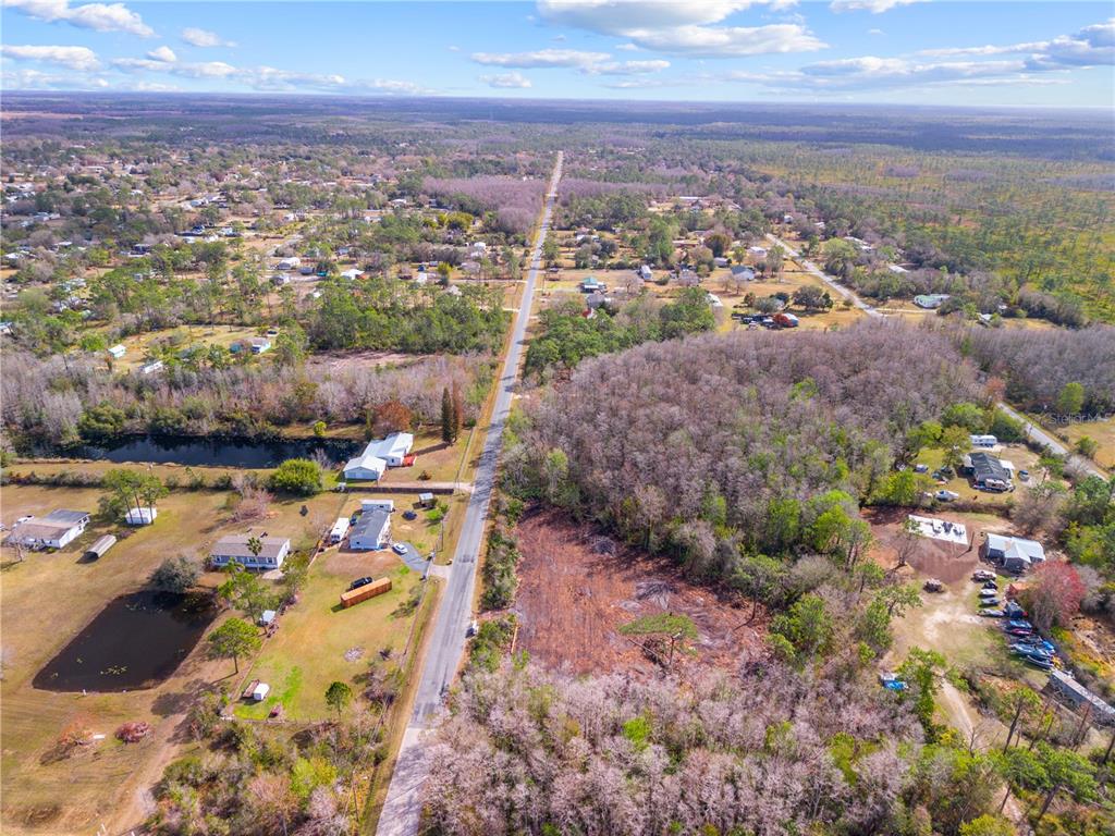 Holopaw Rd Street St. Cloud, FL 34773 - Photo 9 of 18 an aerial view of residential houses with outdoor space