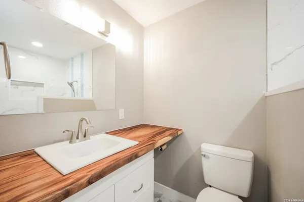 a bathroom with a sink and a toilet