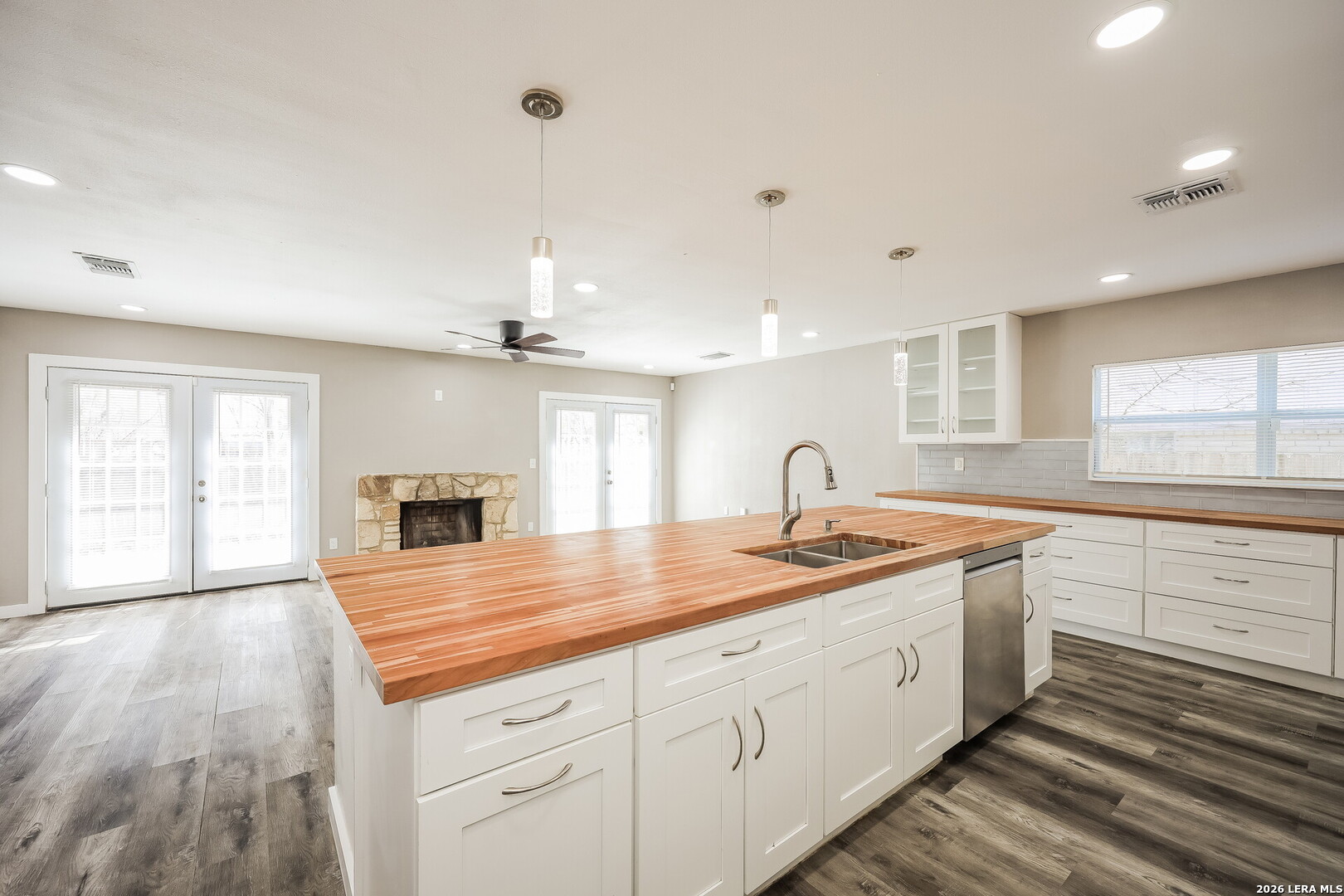 7030 Settlers Ridge Leon Valley, TX 78238 - Photo 8 of 19 a kitchen with sink stove and cabinets
