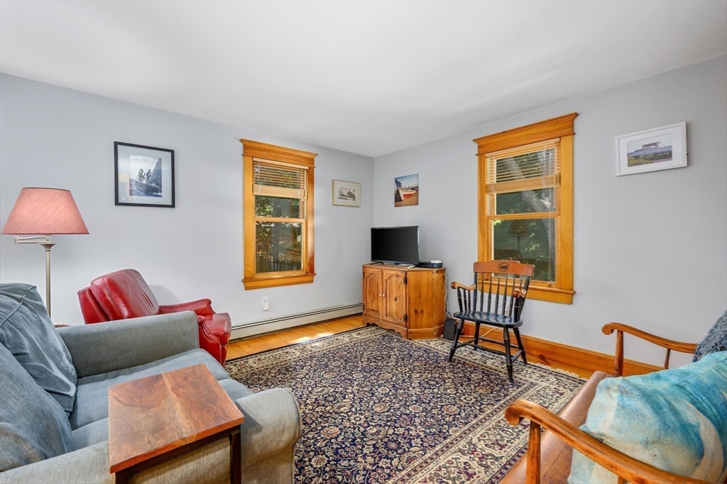 213 Hinckley Road Barnstable, MA 02601 - Photo 18 of 39 a living room with furniture and a window