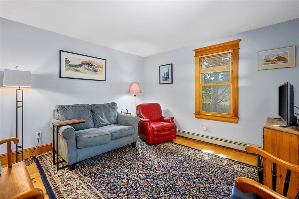 213 Hinckley Road Barnstable, MA 02601 - Photo 19 of 39 a living room with furniture and a flat screen tv