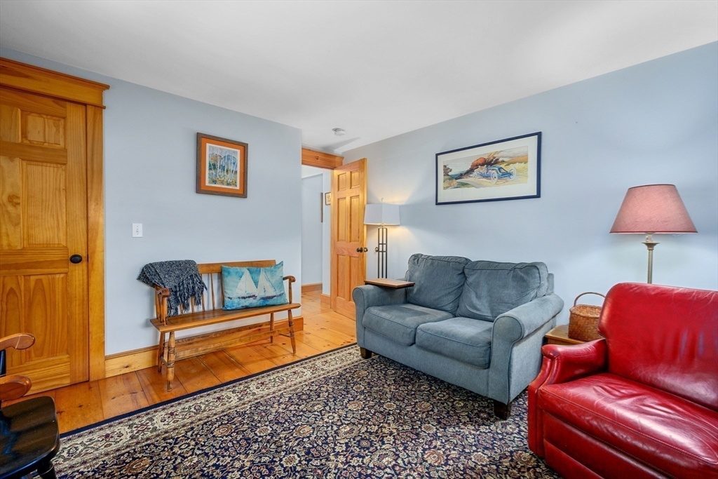213 Hinckley Road Barnstable, MA 02601 - Photo 20 of 39 a living room with furniture and a rug