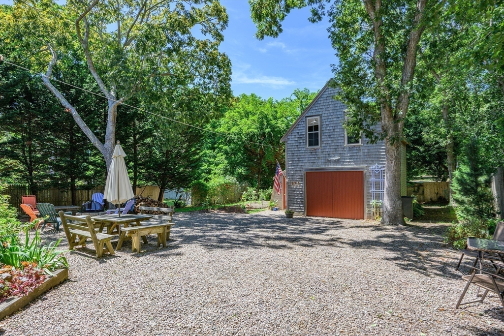 213 Hinckley Road Barnstable, MA 02601 - Photo 30 of 39 a backyard of a house with seating space