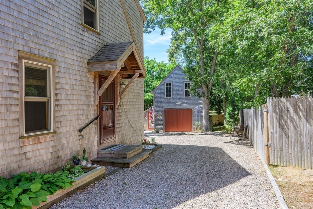 213 Hinckley Road Barnstable, MA 02601 - Photo 32 of 39 a view of a house with a yard and tree