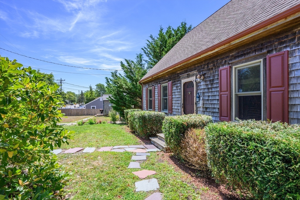 213 Hinckley Road Barnstable, MA 02601 - Photo 4 of 39 a view of a backyard with potted plants