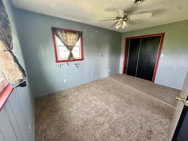 a view of a hallway with a window