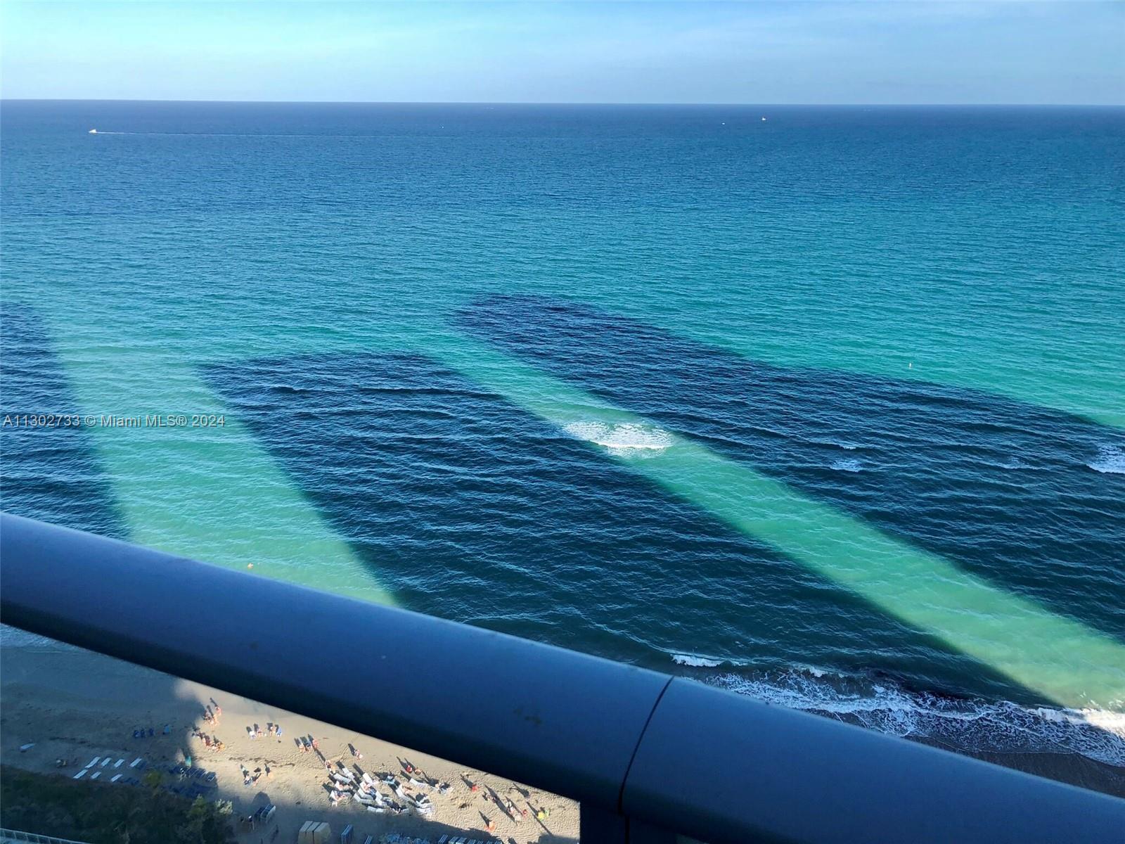 a view of an ocean from a balcony