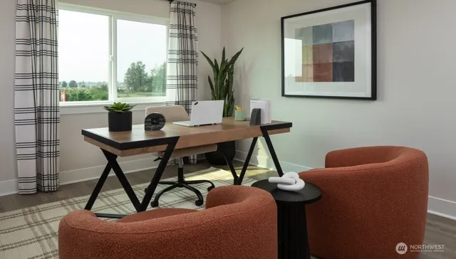 a view of walk in closet with clothes and white walls