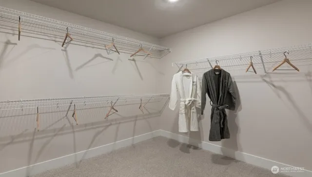 a spacious bathroom with a granite countertop sink a mirror and shower