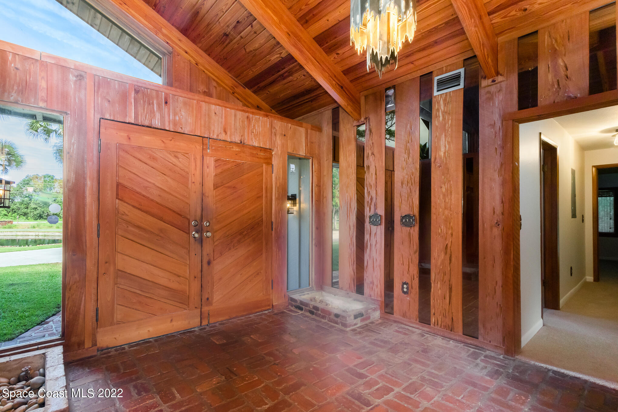 2187 Turtle Mound Road Melbourne, FL 32934 - Photo 11 of 42 a view of a back yard from a hallway