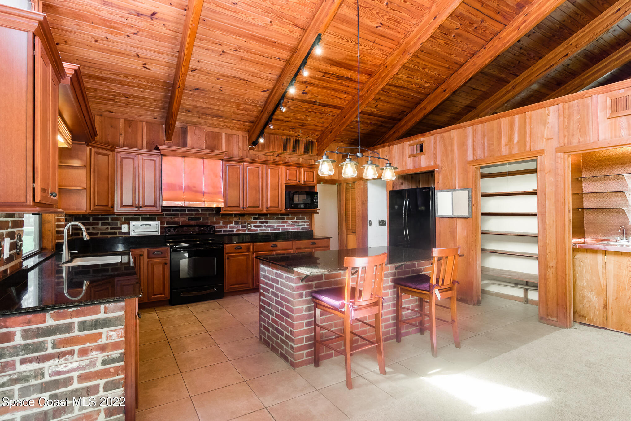 2187 Turtle Mound Road Melbourne, FL 32934 - Photo 15 of 42 a view of a chairs and tables in the patio