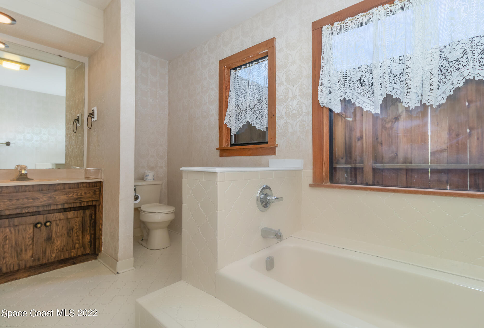 2187 Turtle Mound Road Melbourne, FL 32934 - Photo 28 of 42 a bathroom with a bathtub sink and toilet