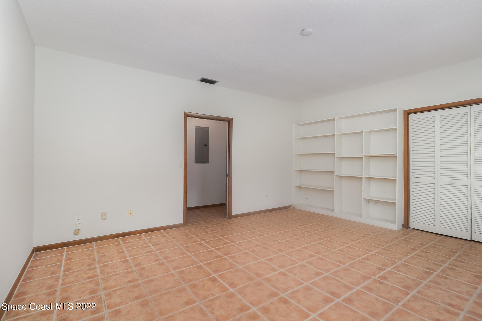 2187 Turtle Mound Road Melbourne, FL 32934 - Photo 32 of 42 a view of an empty room with a closet