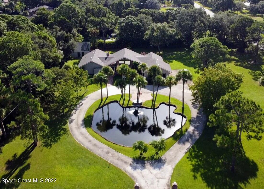 2187 Turtle Mound Road Melbourne, FL 32934 - Photo 42 of 42 a view of a lake with a mountain in the background