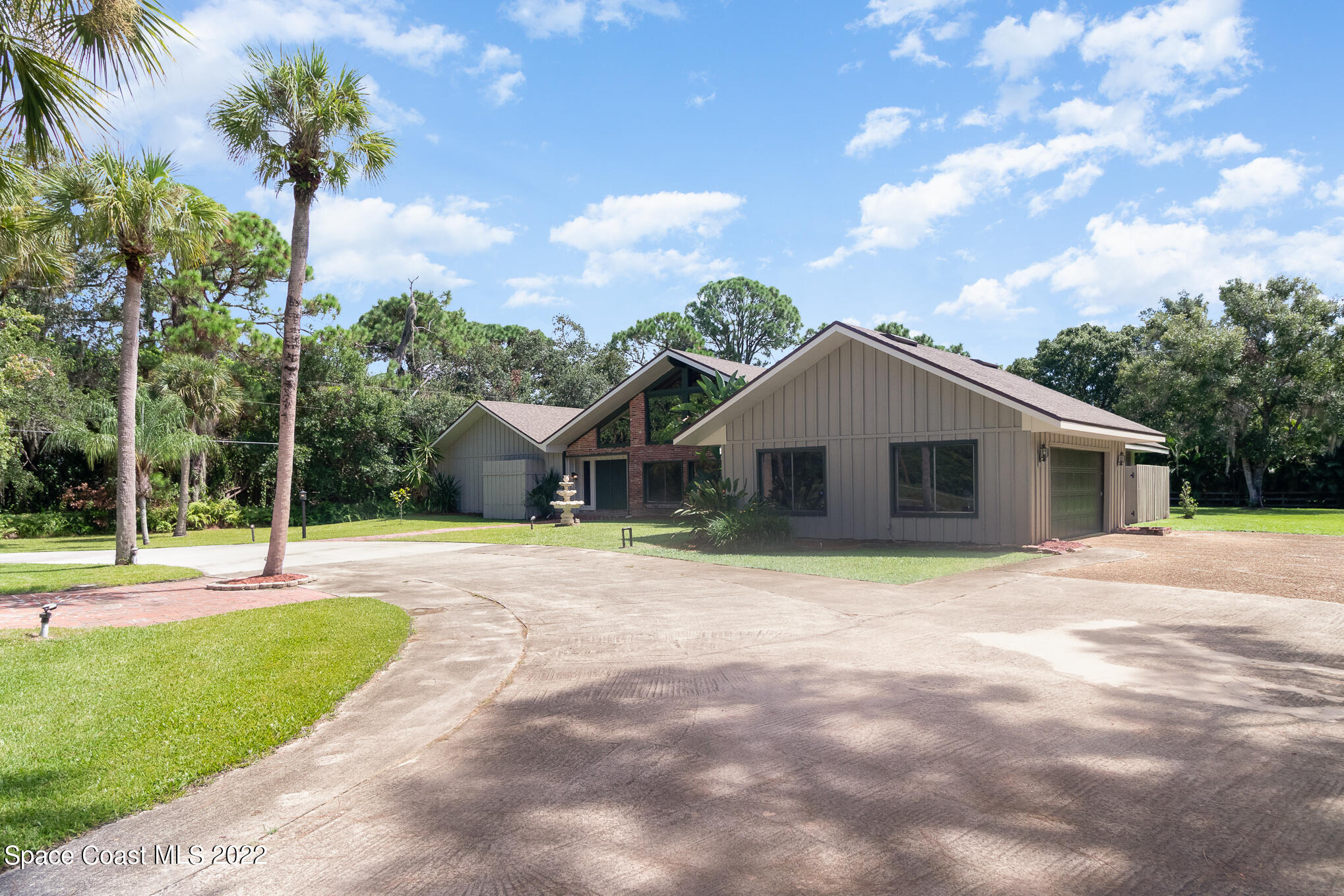 2187 Turtle Mound Road Melbourne, FL 32934 - Photo 5 of 42 a house view with a garden space
