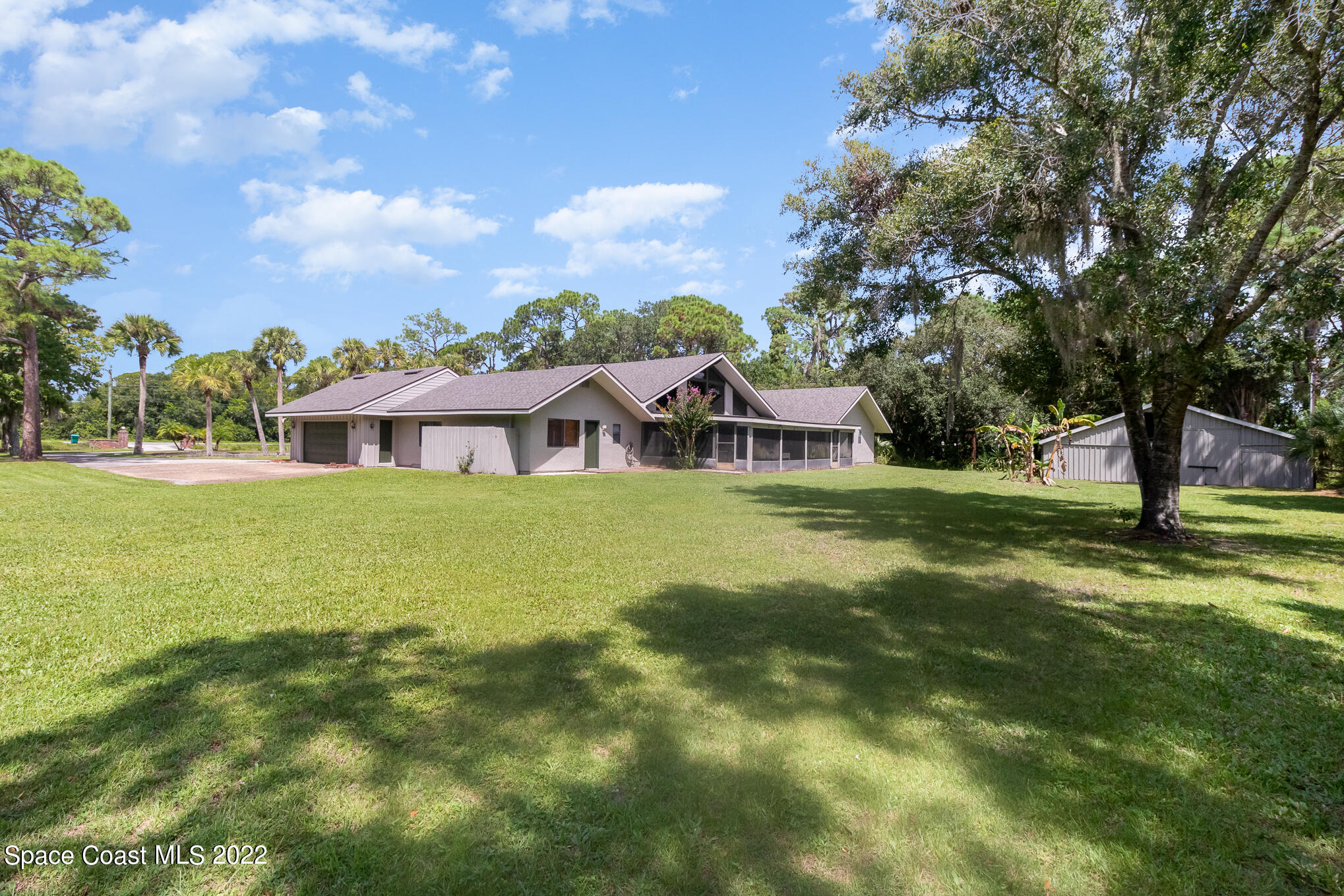 2187 Turtle Mound Road Melbourne, FL 32934 - Photo 9 of 42 a view of a house with a big yard