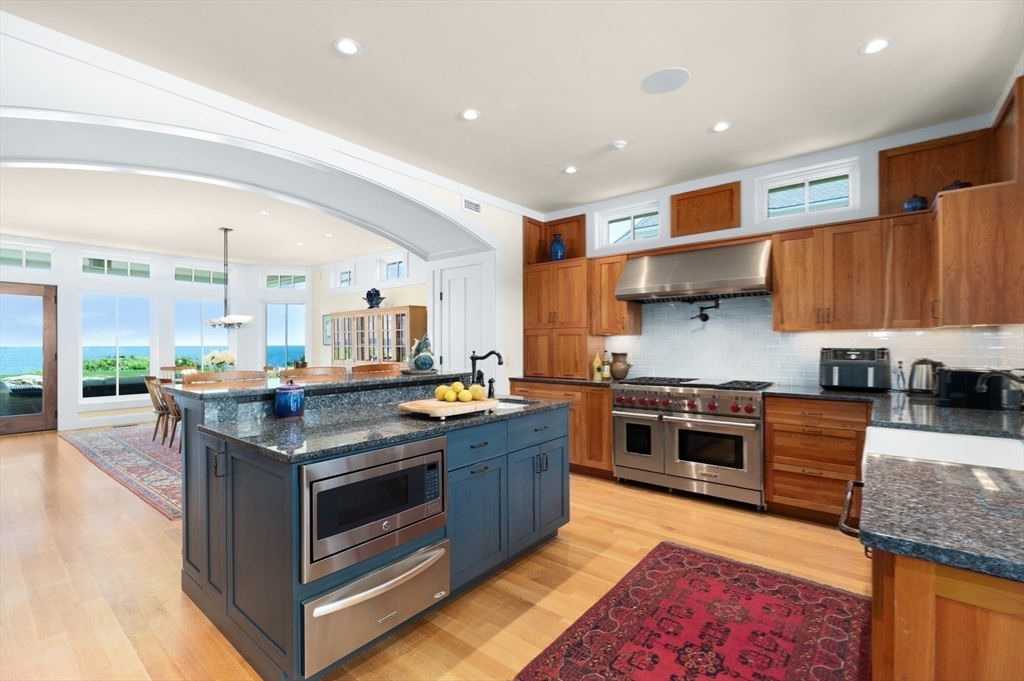 131 Atlantic Road Gloucester, MA 01930 - Photo 13 of 40 a kitchen with stainless steel appliances granite countertop a stove and a sink