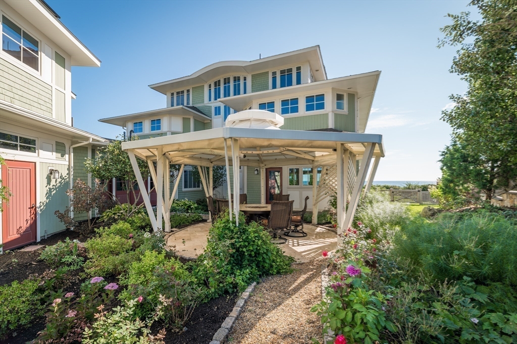 131 Atlantic Road Gloucester, MA 01930 - Photo 14 of 40 a front view of a house with garden and porch