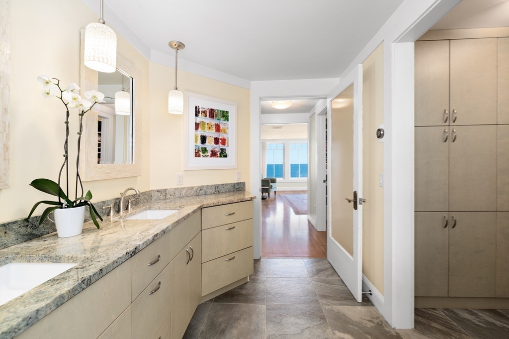 131 Atlantic Road Gloucester, MA 01930 - Photo 19 of 40 a bathroom with a granite countertop sink mirror and a