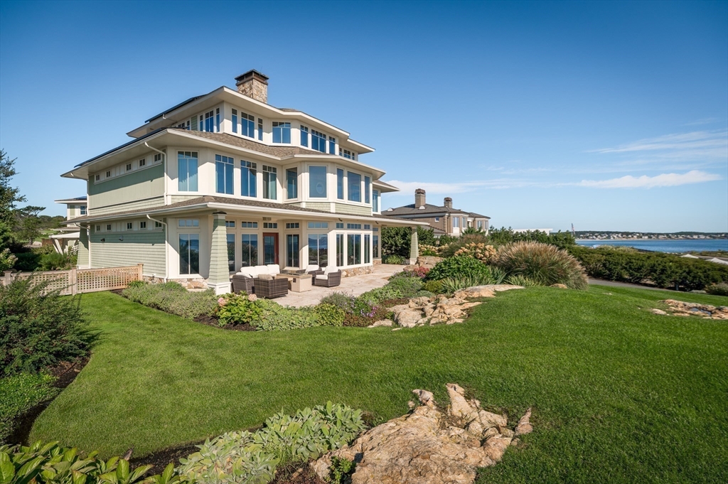 131 Atlantic Road Gloucester, MA 01930 - Photo 2 of 40 a front view of a house with a yard