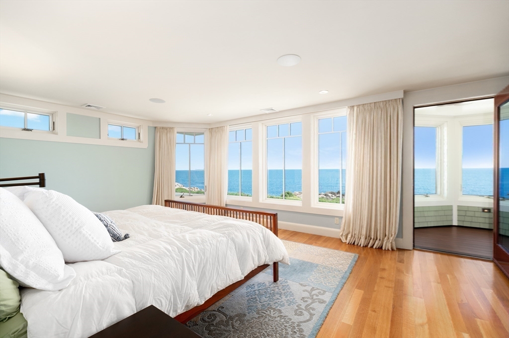 131 Atlantic Road Gloucester, MA 01930 - Photo 23 of 40 a spacious bedroom with a bed and a large window