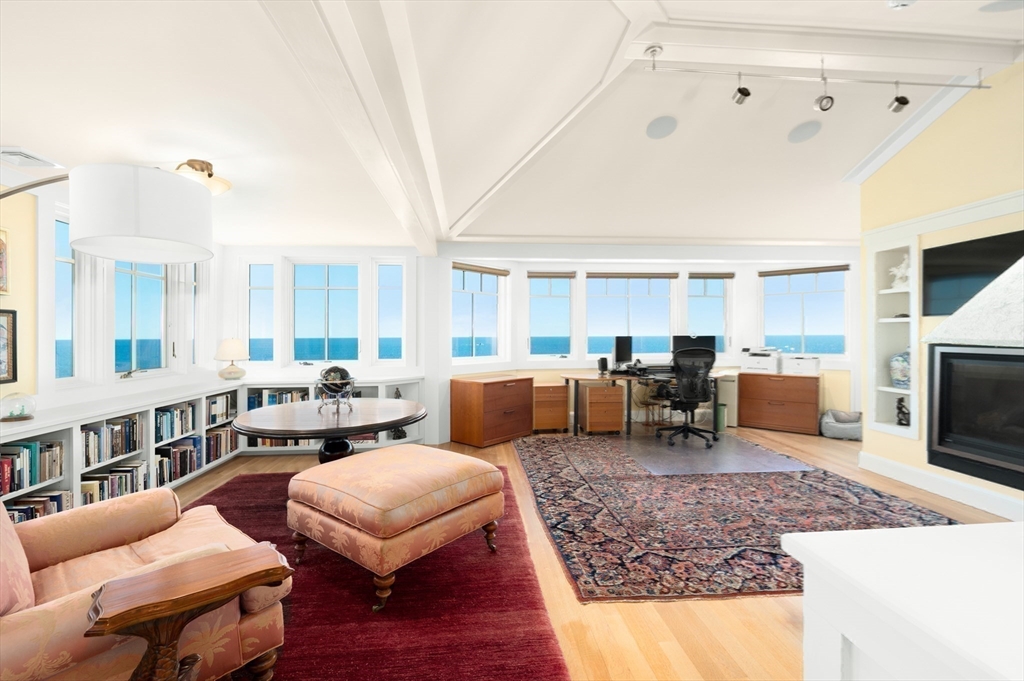 131 Atlantic Road Gloucester, MA 01930 - Photo 27 of 40 a living room with furniture and a fireplace