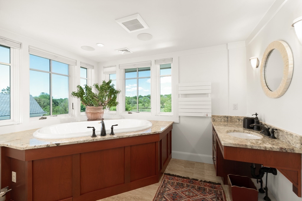 131 Atlantic Road Gloucester, MA 01930 - Photo 30 of 40 a bathroom with a sink and a large mirror