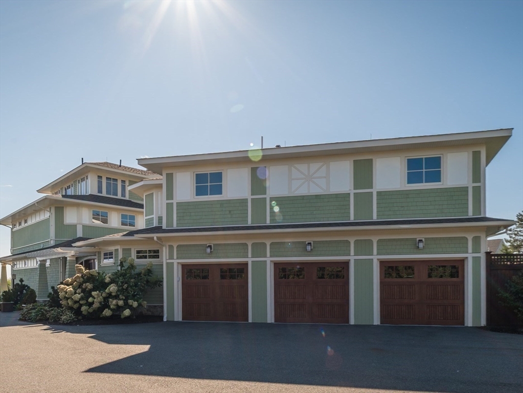 131 Atlantic Road Gloucester, MA 01930 - Photo 32 of 40 a front view of a house with a garden