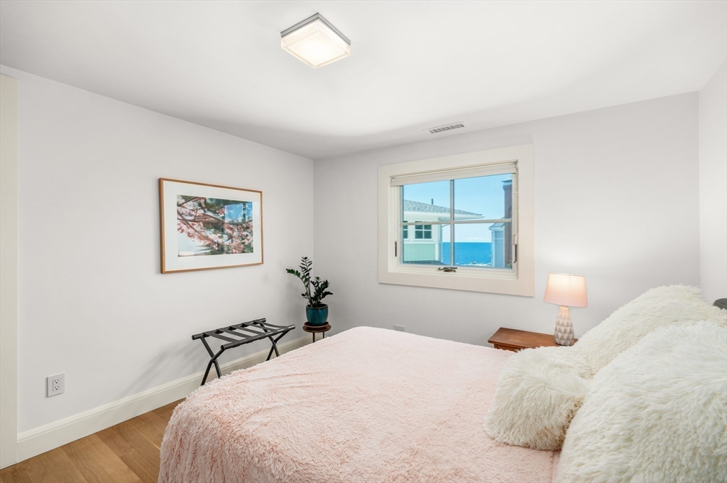 131 Atlantic Road Gloucester, MA 01930 - Photo 36 of 40 a bedroom with a large bed and a window