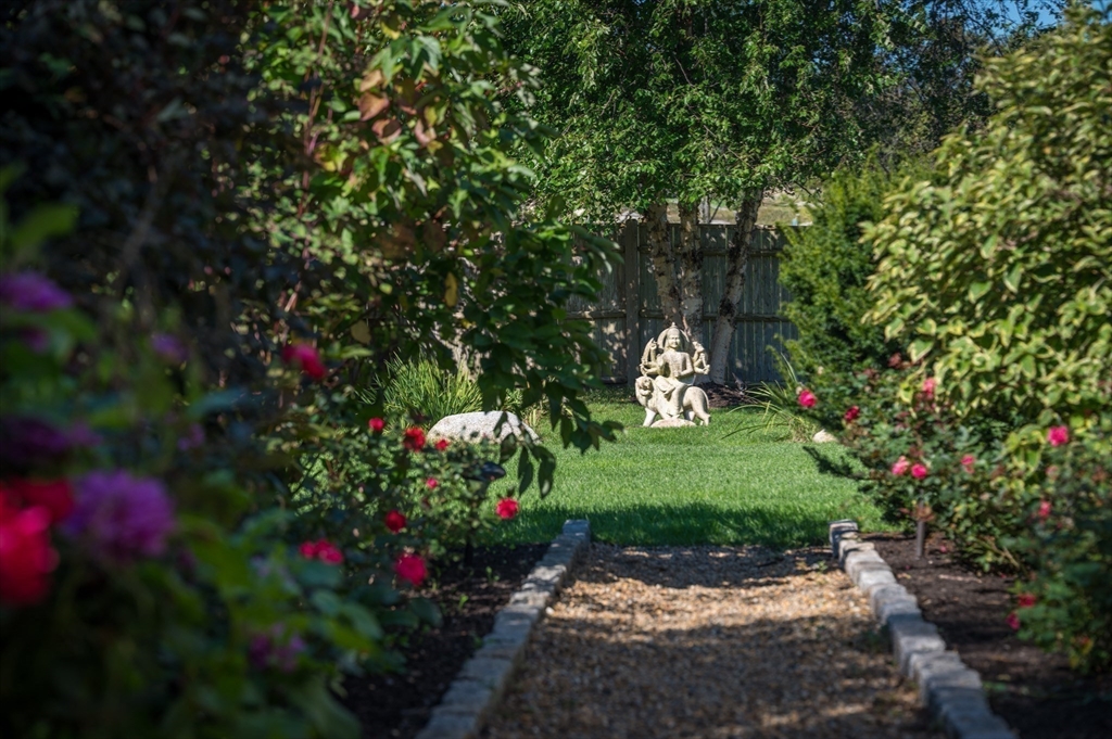 131 Atlantic Road Gloucester, MA 01930 - Photo 38 of 40 a backyard of a house with a yard and outdoor seating