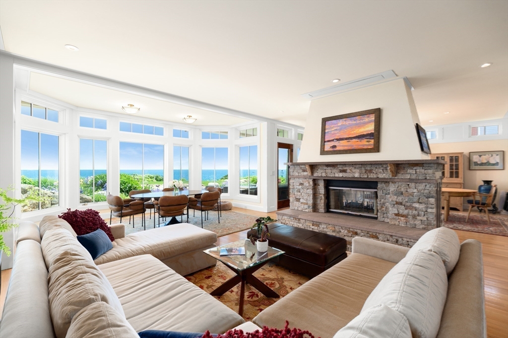 131 Atlantic Road Gloucester, MA 01930 - Photo 6 of 40 a living room with furniture and a fireplace