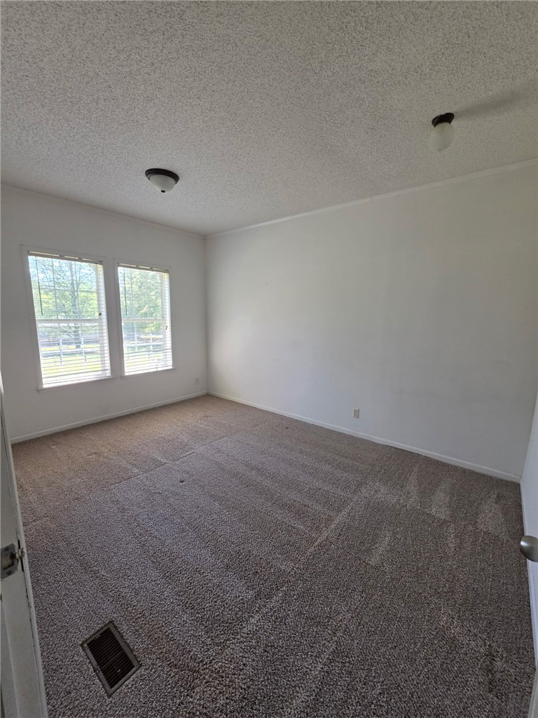 1400 Massey Road Pendleton, SC 29670 - Photo 22 of 25 This spacious room offers comfortable carpet flooring and ample natural light through its windows.