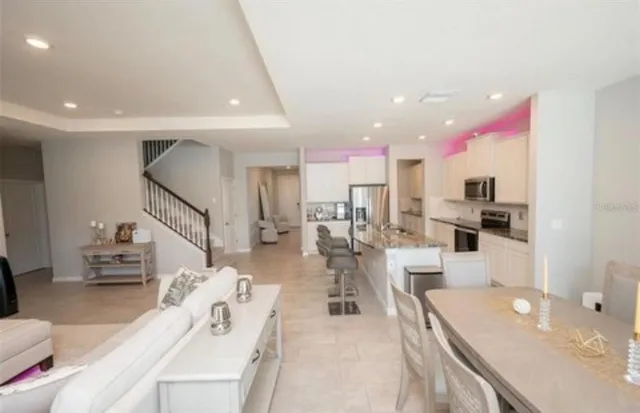 a living room with furniture and a table