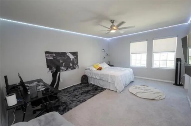 a bedroom with double bed and a window