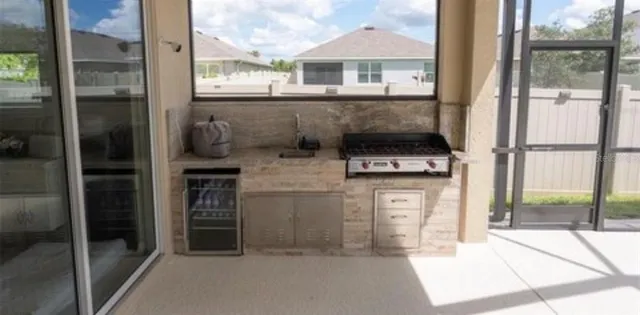 a kitchen view with a stove sitting inside of a house