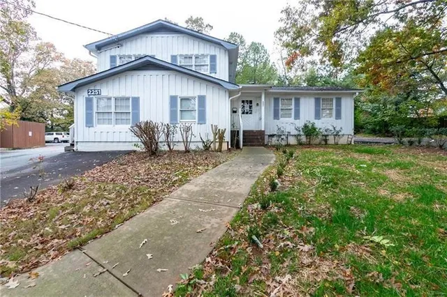 a front view of house with yard and seating area