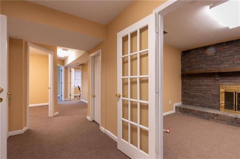 2251 Roswell Road Northeast Marietta, GA 30062 - Photo 6 of 12 a view of a hallway with wooden floor and entryway