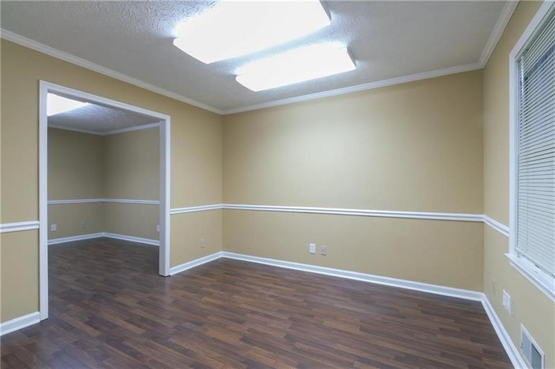 2251 Roswell Road Northeast Marietta, GA 30062 - Photo 9 of 12 an empty room with wooden floor