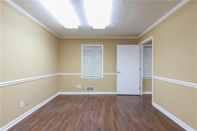 2251 Roswell Road Northeast Marietta, GA 30062 - Photo 10 of 12 a view of room with window and wooden floor