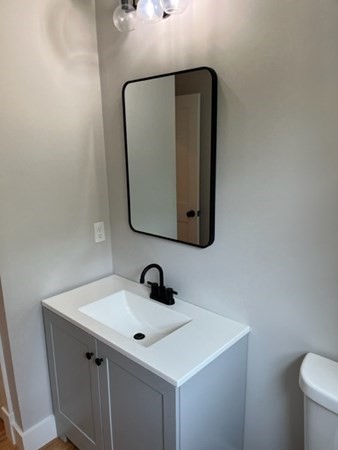 19 Indian Road, Unit B Groton, MA 01450 - Photo 11 of 27 a bathroom with a sink and a mirror