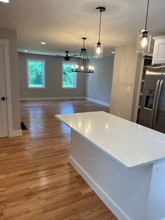 19 Indian Road, Unit B Groton, MA 01450 - Photo 6 of 27 a view of a room with wooden floor and windows