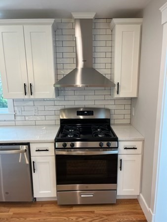 19 Indian Road, Unit B Groton, MA 01450 - Photo 8 of 27 a stove top oven sitting inside of a kitchen