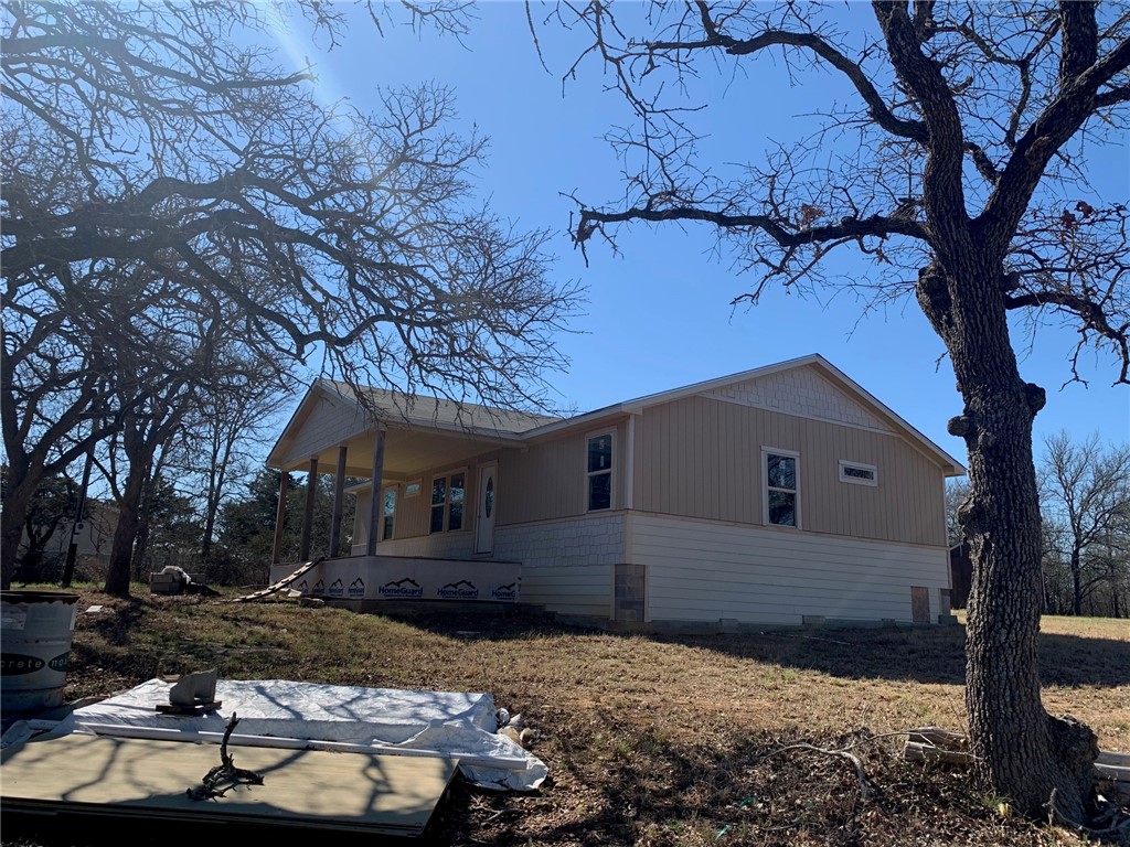 629 Riddle Road Cedar Creek, TX 78612 - Photo 1 of 1 a backyard of a house with lots of green space